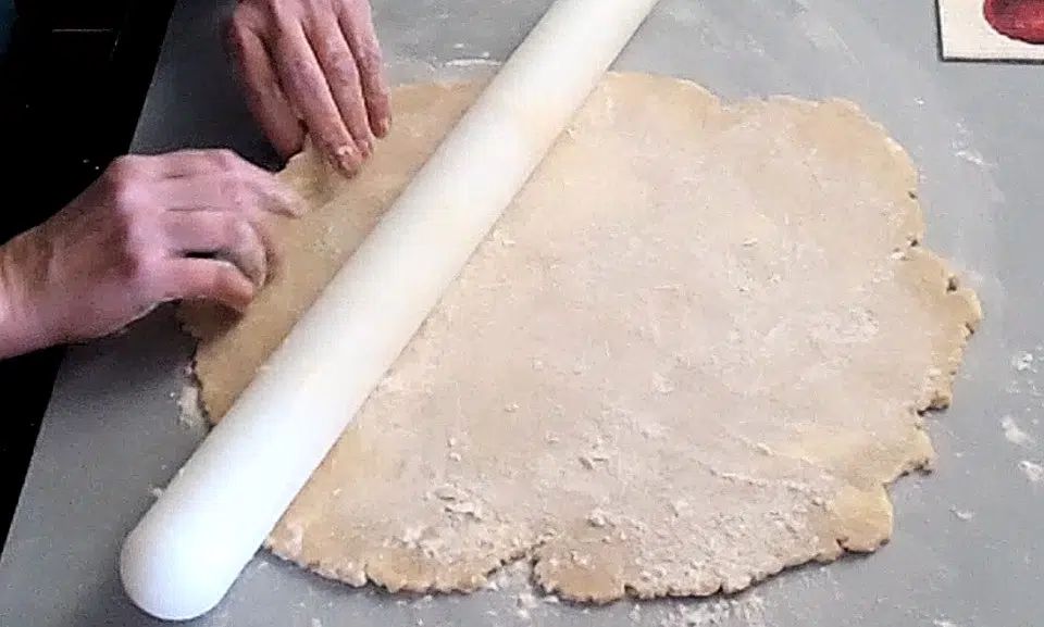 pie crust rolled out on workspace