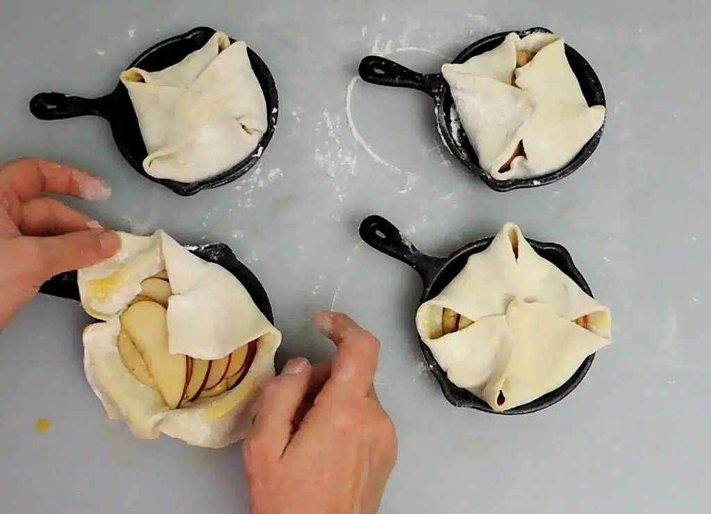 assembling apple walnut frangipane in baking dishes