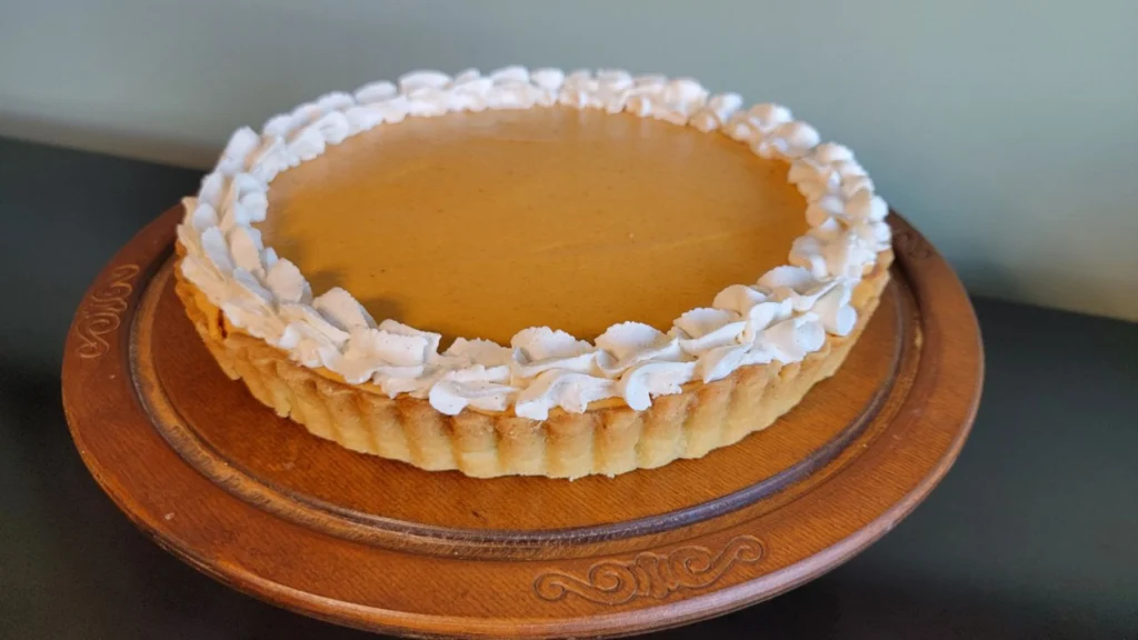 finished pumpkin chiffon tart with whipped cream topping