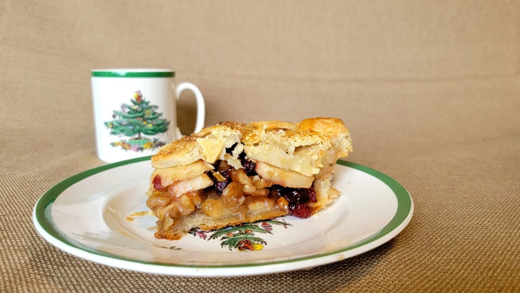 apple walnut pie slice with cranberries
