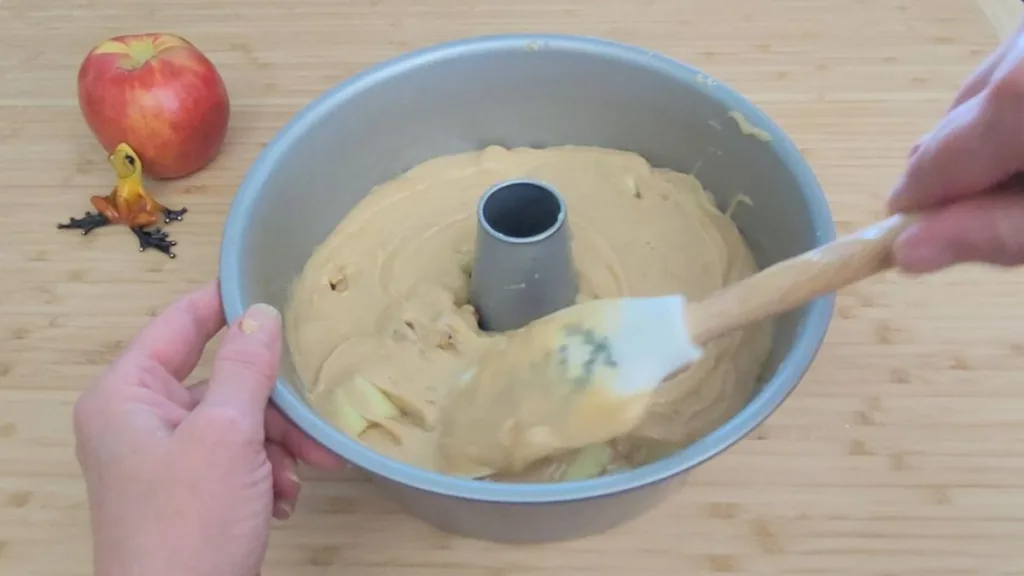 filling Bundt cake pan with batter