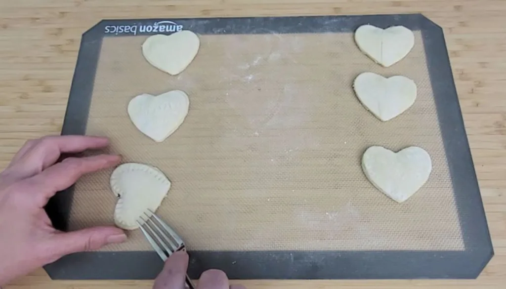 crimping edges of heart shaped pastries