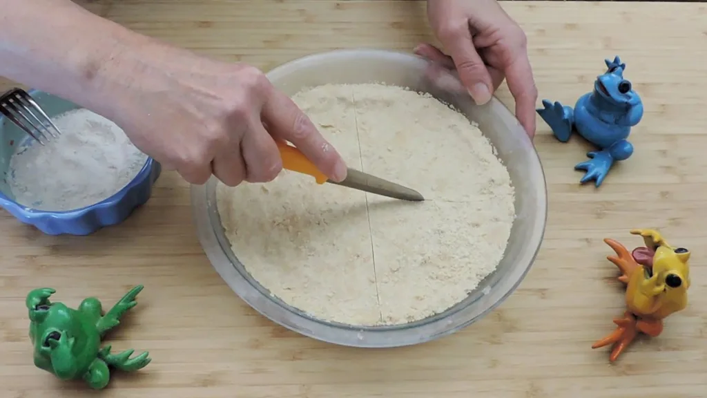 cutting dough with knife