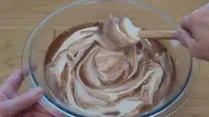 folding whipped cream into custard to make chocolate Bavarian cream