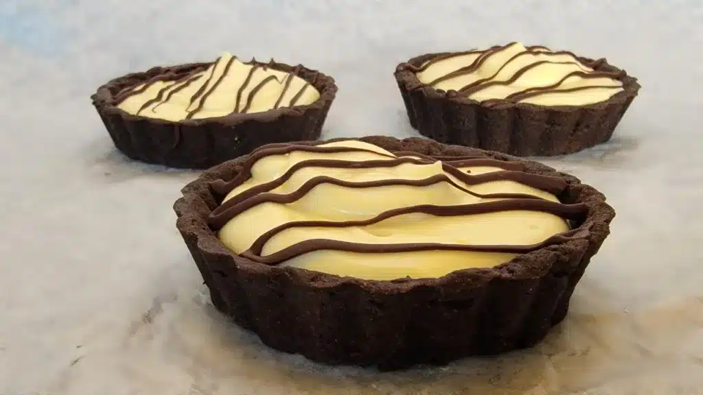 banana cream individual tarts in a chocolate crust