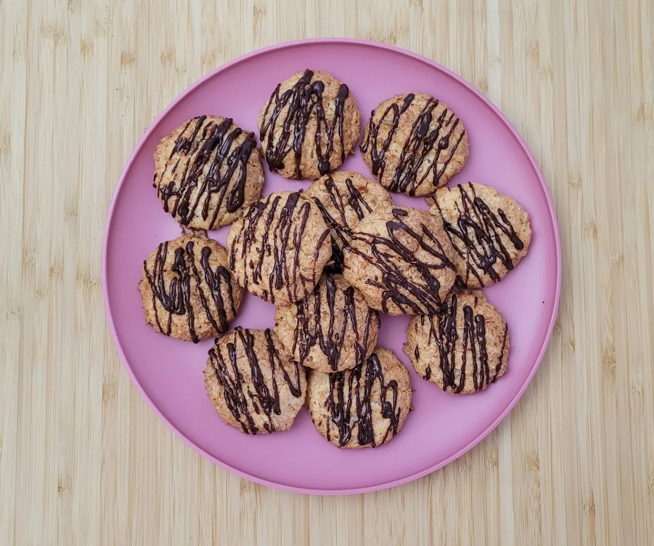 chocolate drizzled macaroons on plate