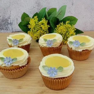 cupcakes with mango curd and cream cheese frosting