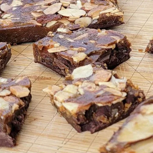 chocolate toffee with almonds on a cutting board