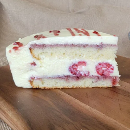slice of white chocolate mousse cake with raspberries