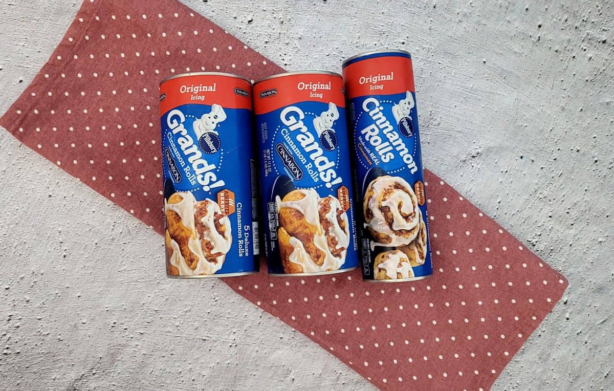 cans of packaged cinnamon rolls