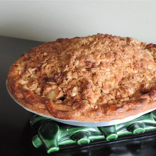 caramel apple crumble pie on a cooling rack