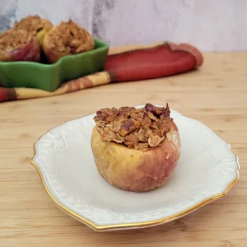 baked apple filled with oatmeal on a plate