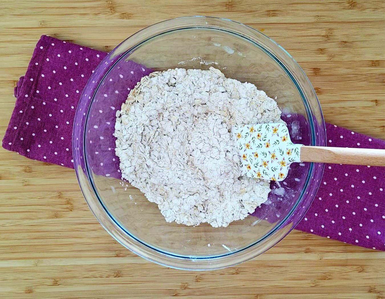 dry ingredients in mixing bowl with spatula