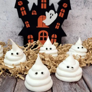 meringue ghosts on a wooden board