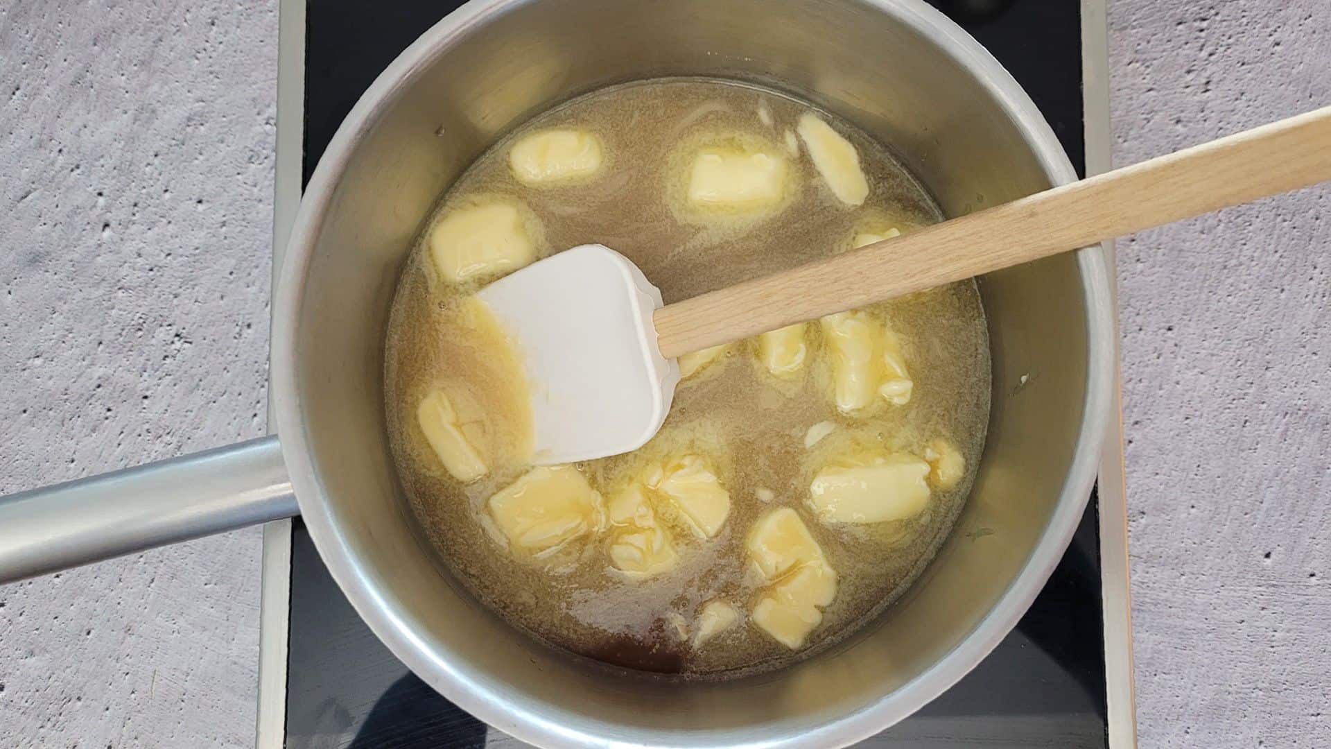 starting to heat caramel for peanut brittle in a saucepan