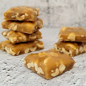peanut brittle pieces on a countertop