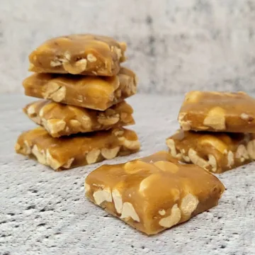 crunchy peanut brittle pieces in stacks