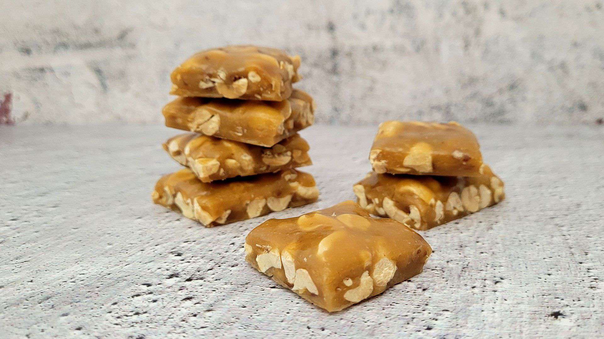 crunchy peanut brittle pieces in stacks