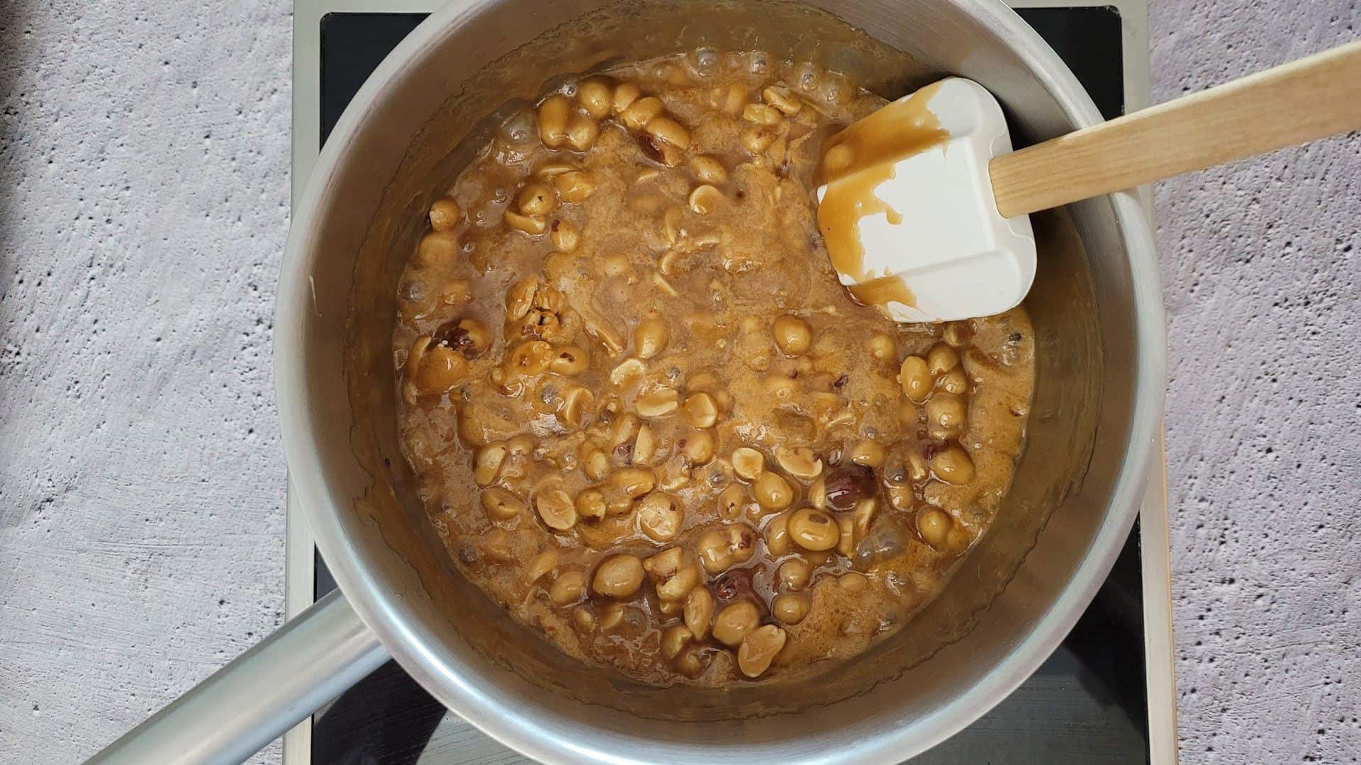 caramel in saucepan with baking soda and peanuts added