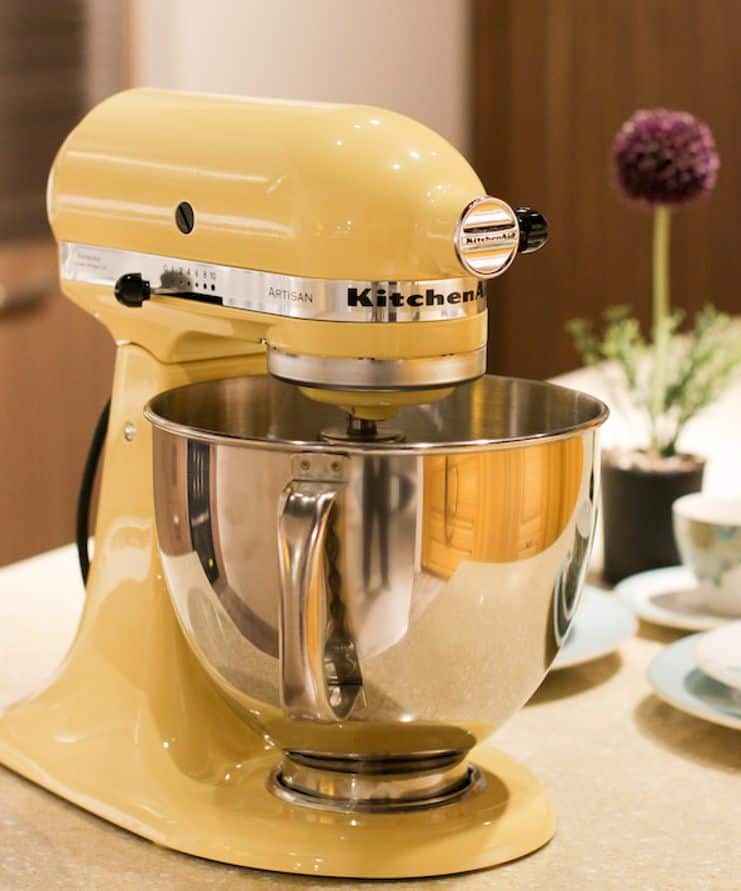 yellow stand mixer on a kitchen countertop