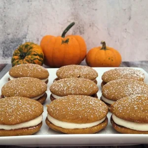 nine gluten-free pumpkin whoopie pies on a serving dish