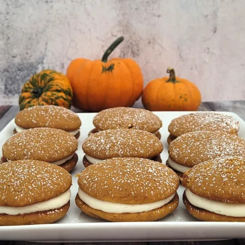 nine gluten-free pumpkin whoopie pies on a serving dish