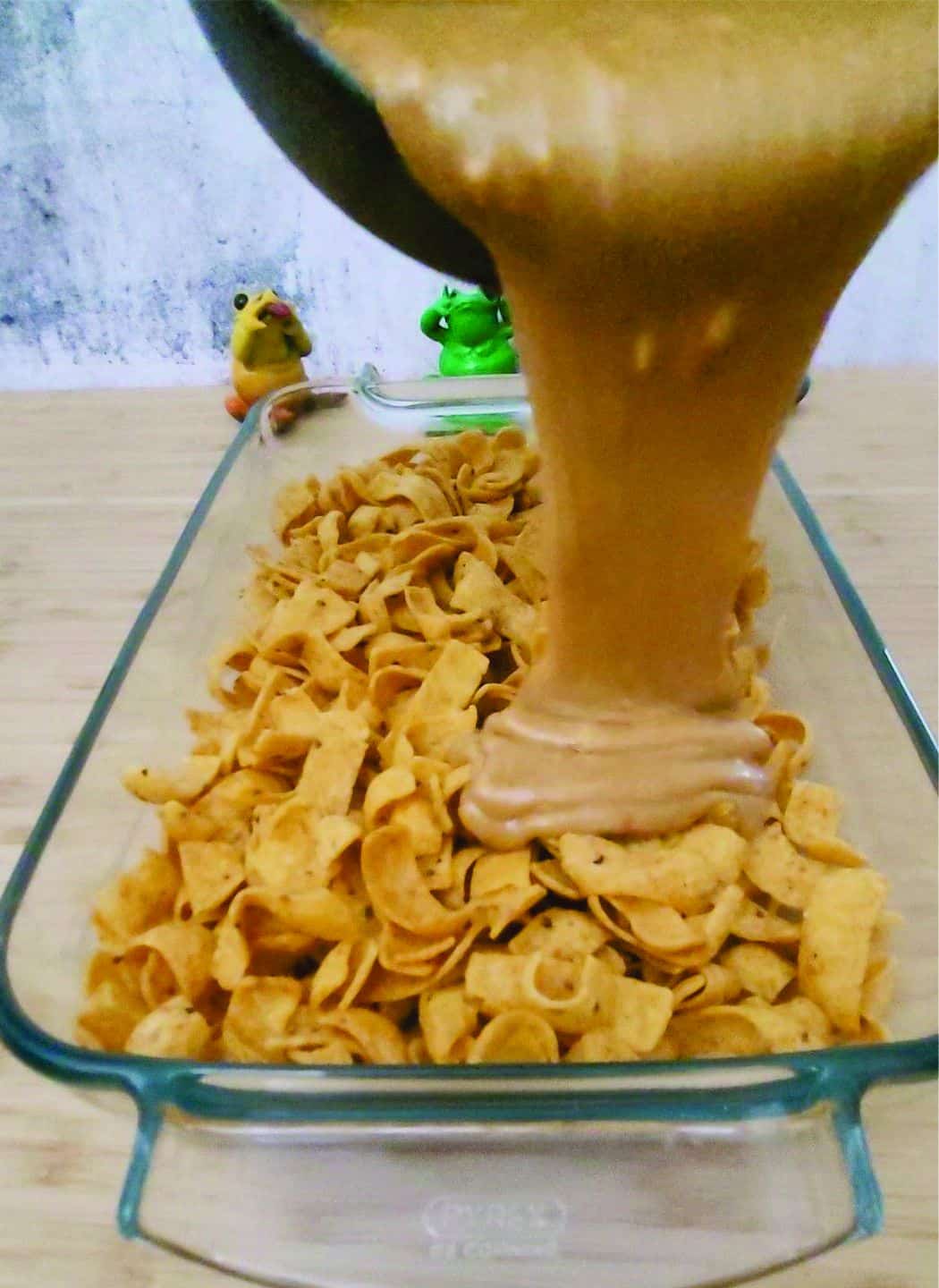 pouring syrup over Fritos 