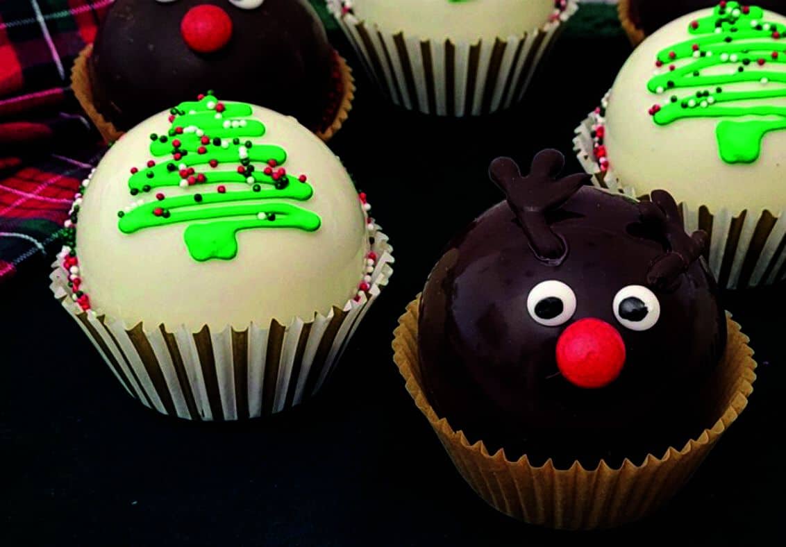 hot cocoa bombs decorated as a Christmas tree and Rudolf the Red Nosed Reindeer