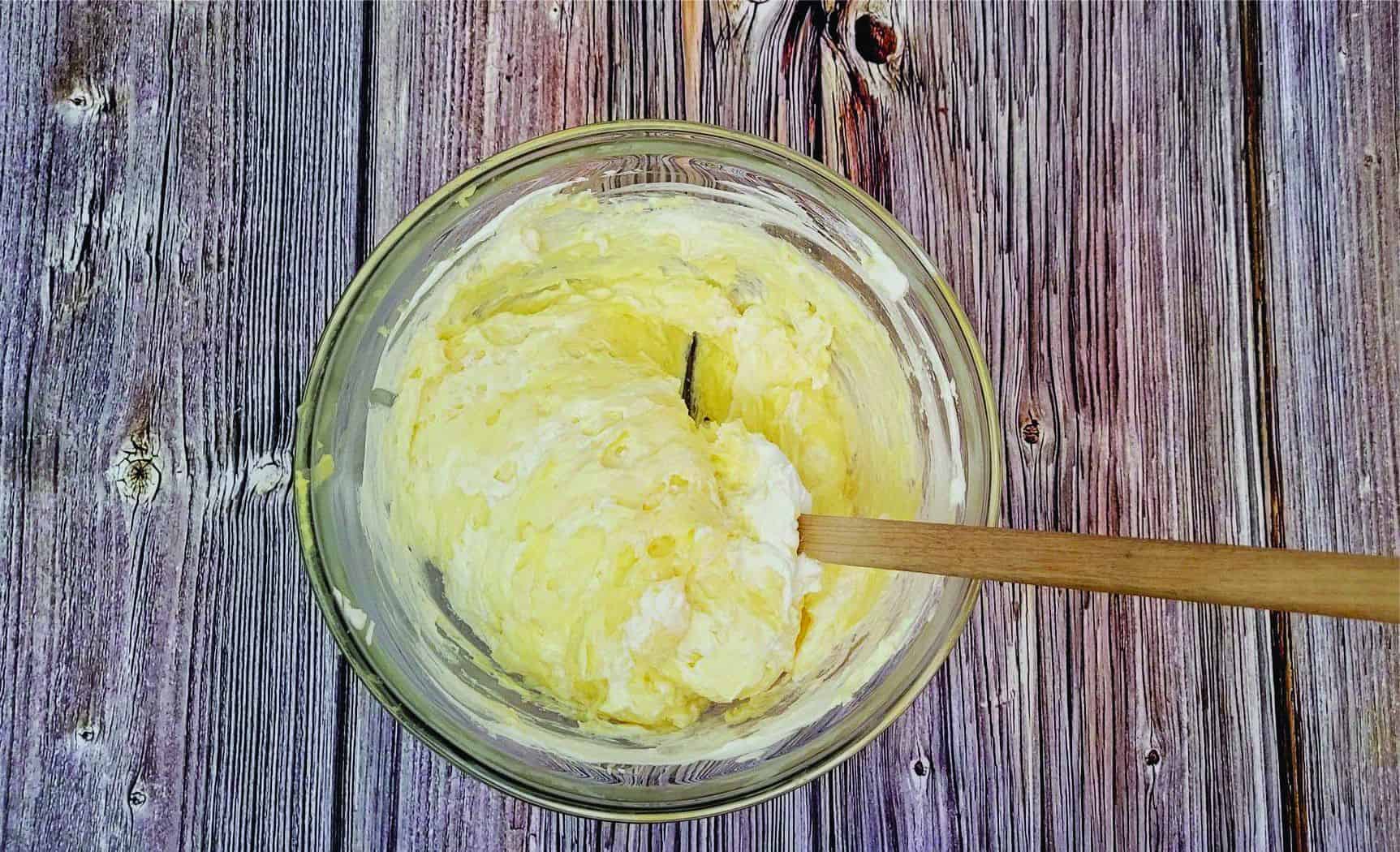 folding whipped cream into pastry cream to lighten the texture