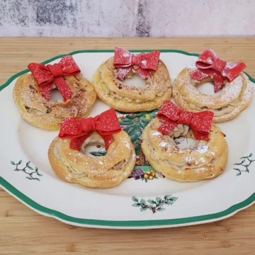 five Paris brest on a plate decorated for Christmas