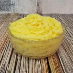 vanilla pastry cream piped into a glass bowl