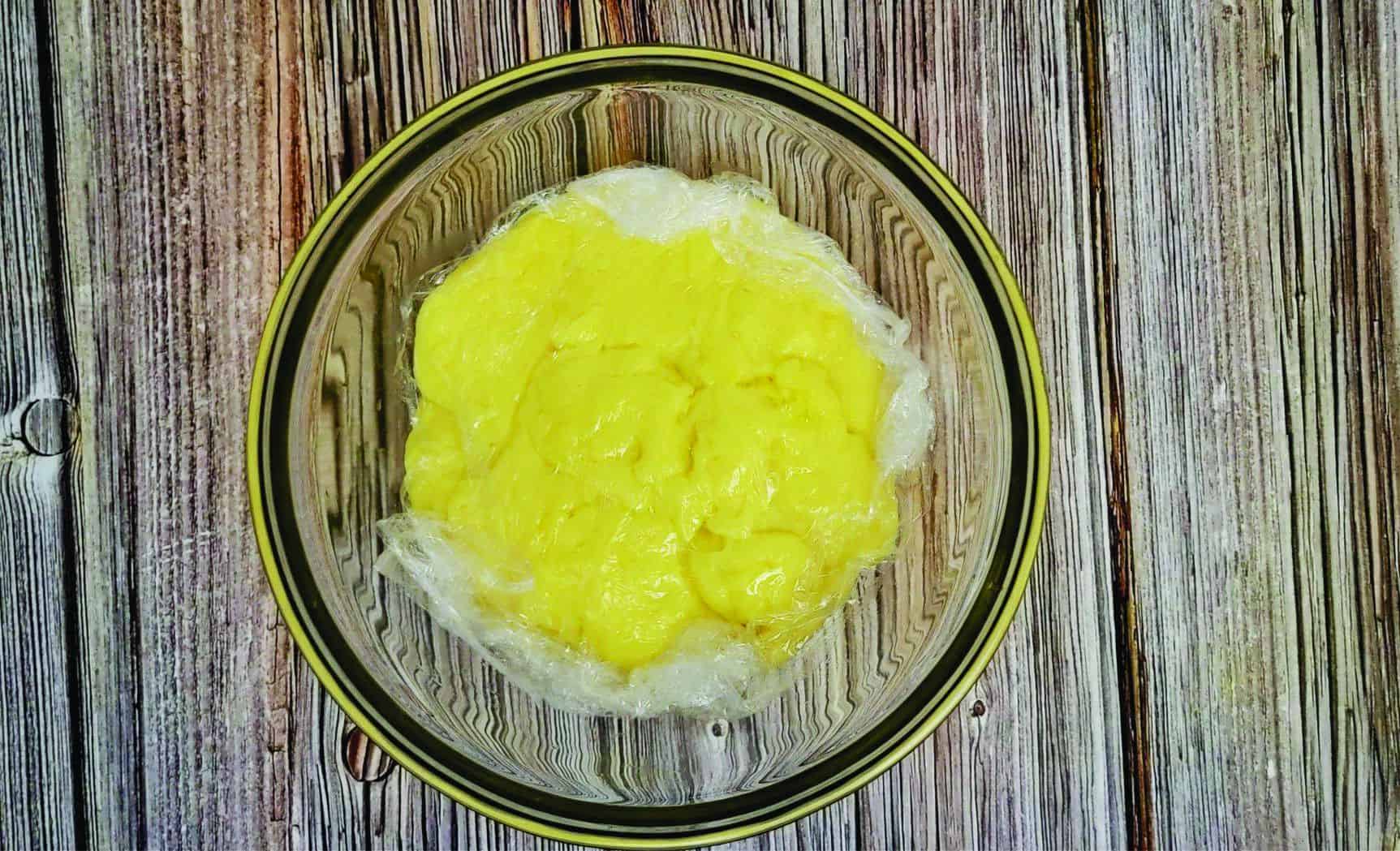 plastic wrapped pressed over the top of pastry cream