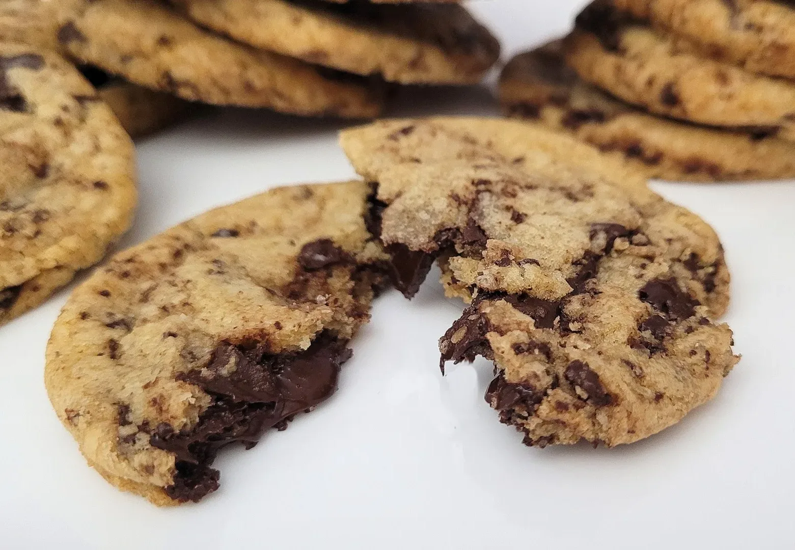 inside view of a warm GF chocolate chunk cookie with more cookies in the background