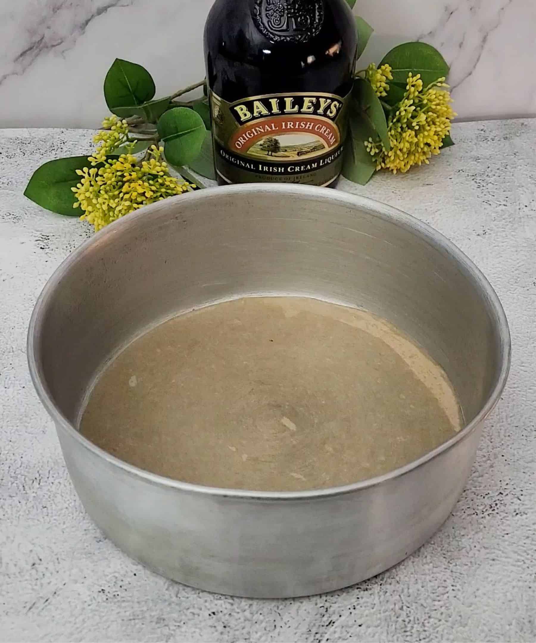 round cake pan prepared with parchment paper lining for baking a cake