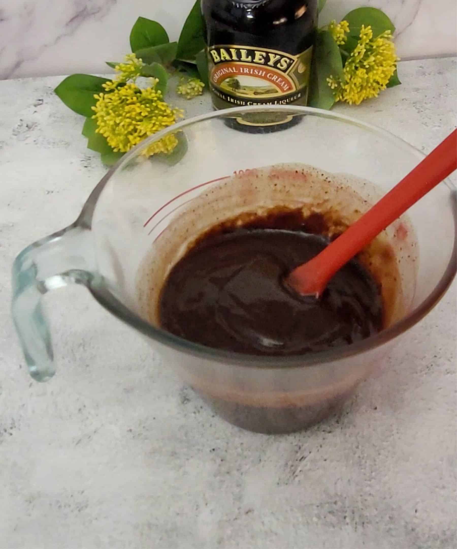 Baileys Irish Cream chocolate ganache mixed together in a glass bowl