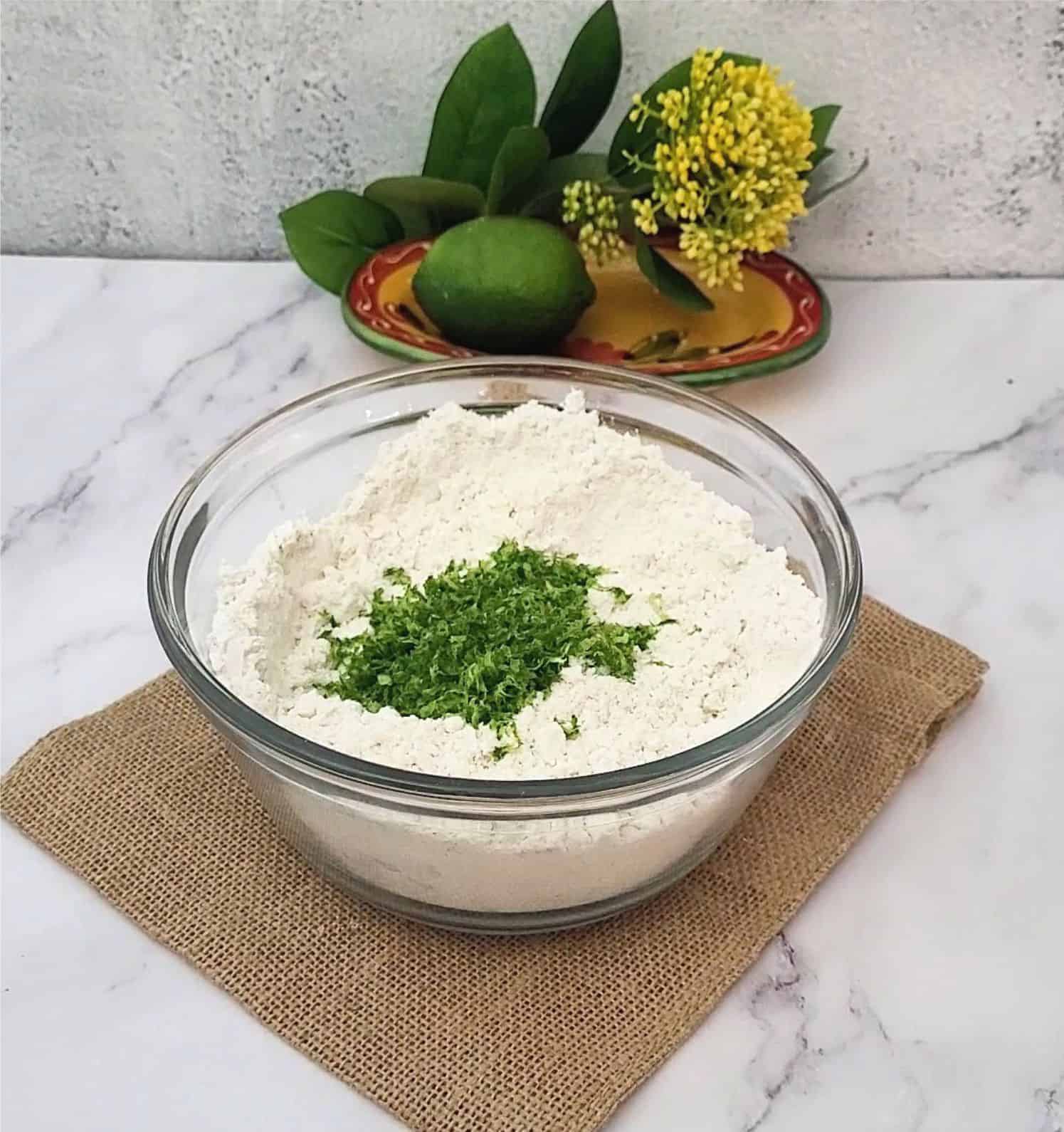 Combine flour, baking soda, lime zest and salt in bowl