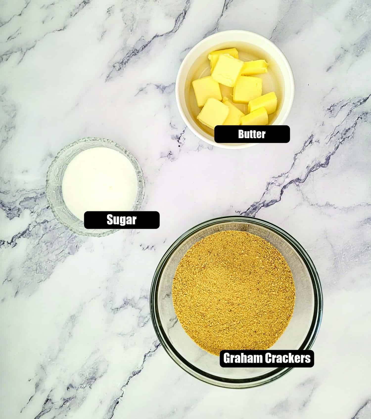 ingredients needed to make no bake graham cracker crust including graham cracker crumbs, butter and granulated sugar