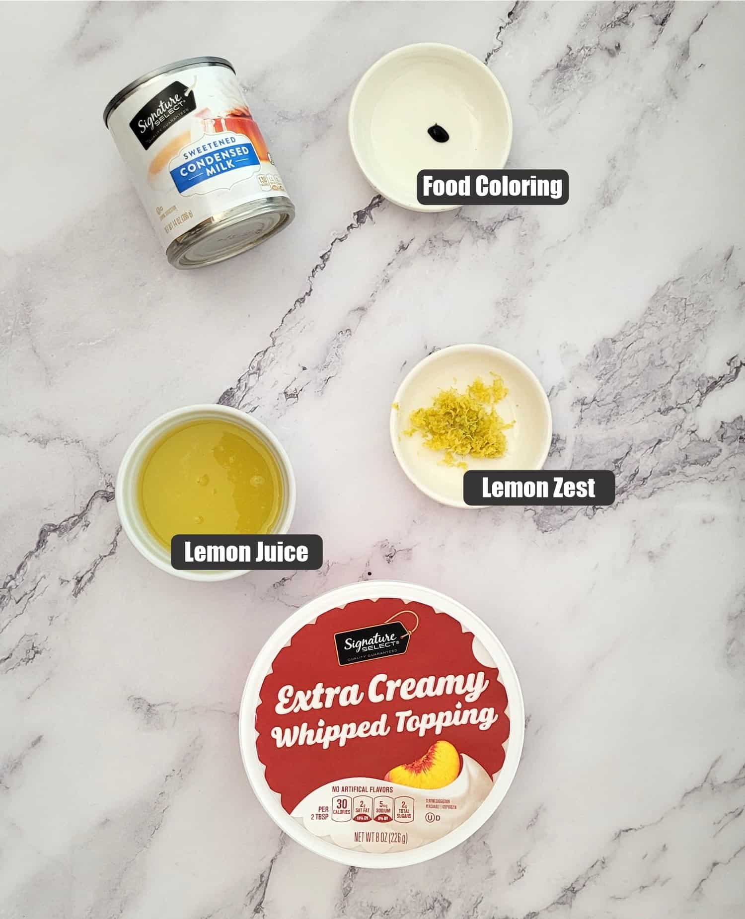 ingredients needed to make the no bake lemon pie filling including whipped topping, lemon juice, lemon zest, sweetened condensed milk and yellow food coloring