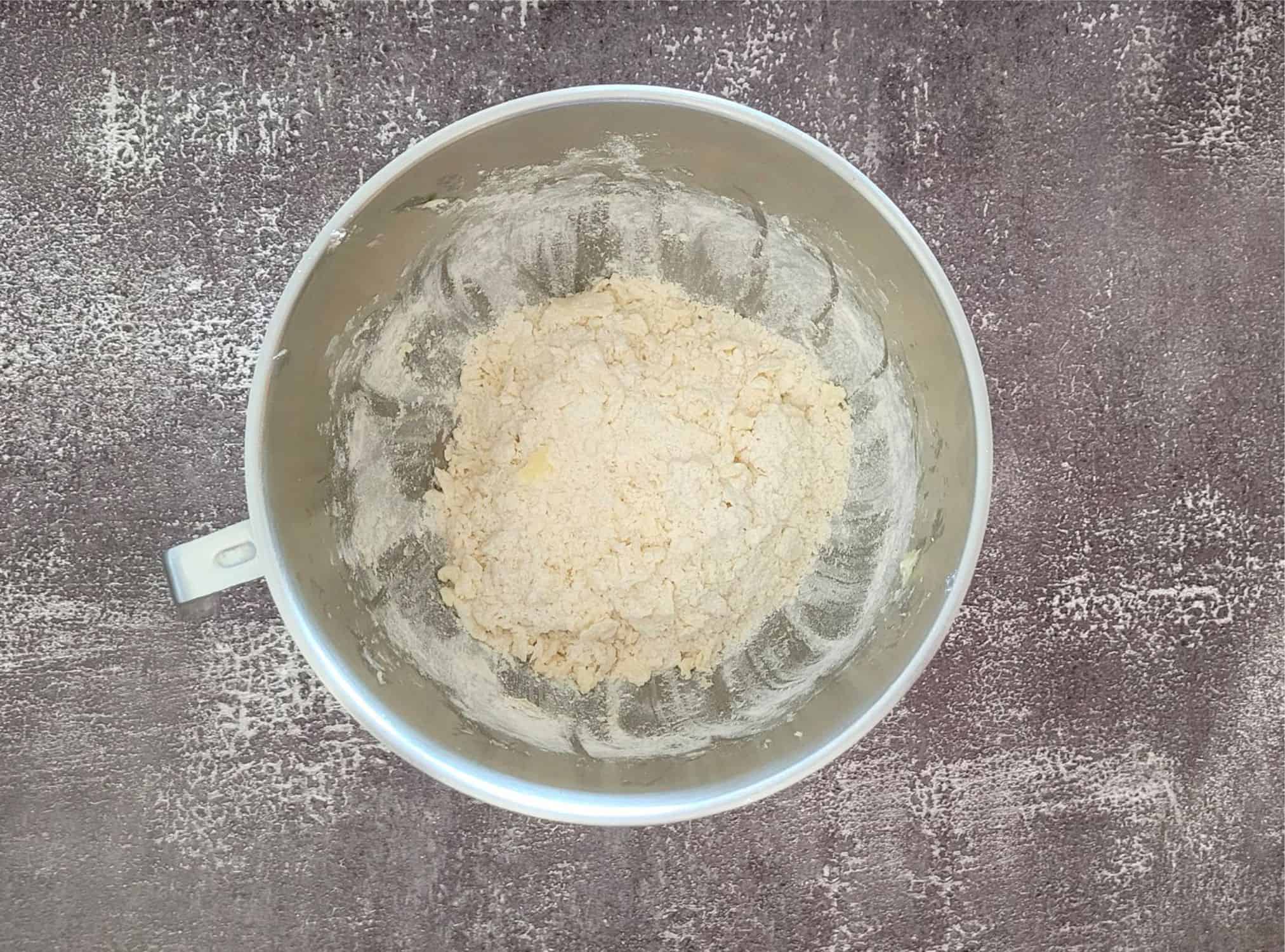flour added to mixing bowl with butter, sugar and salt