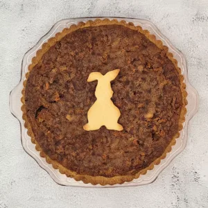 carrot cake pie with an Easter bunny sugar cookie on top for decoration