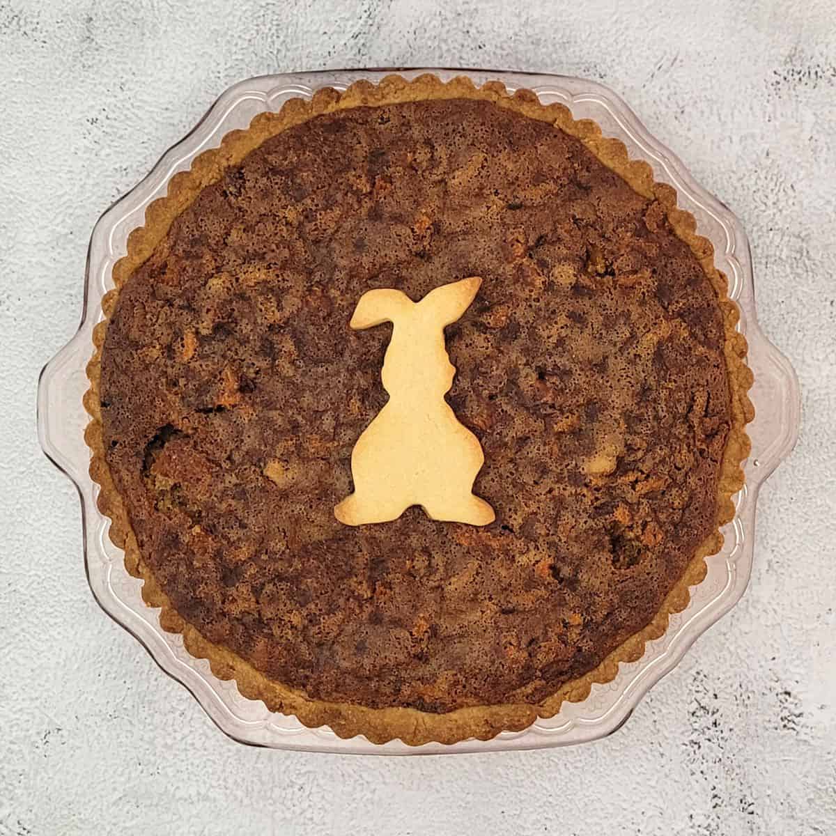 carrot cake pie with an Easter bunny sugar cookie on top for decoration