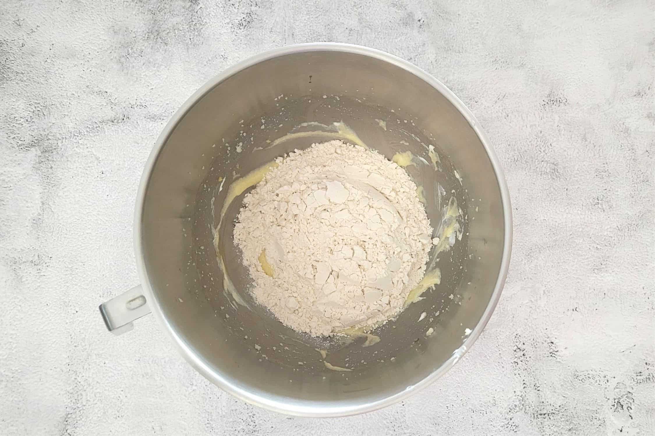 dry ingredients added to mixing bowl to make cookie dough