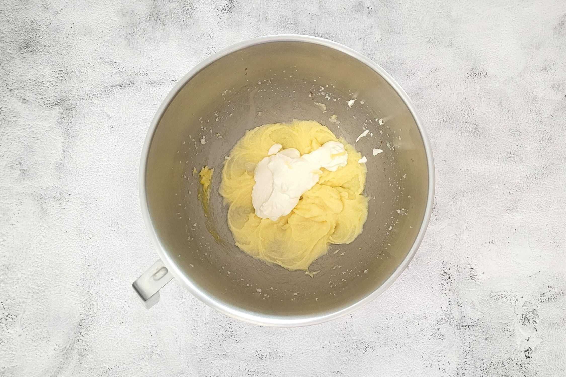 sour cream added to mixing bowl to make cookie dough