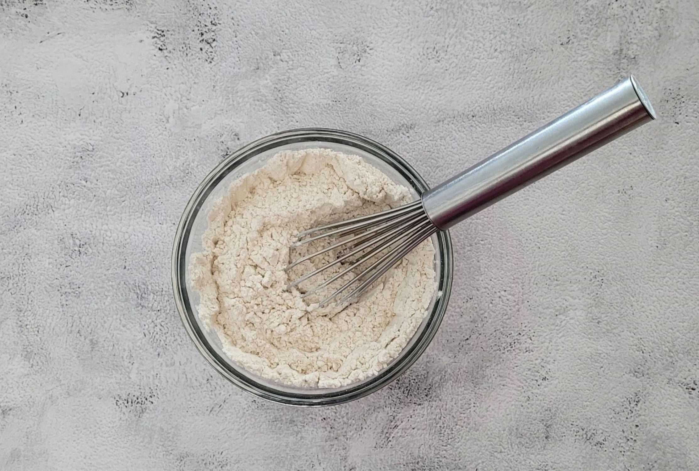 flour, baking soda, baking powder and salt whisked together in a bowl
