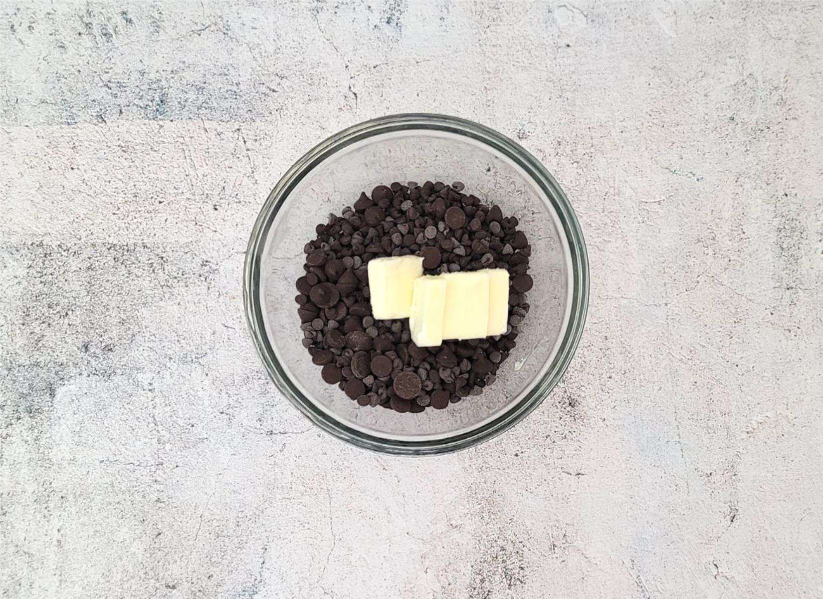 butter and chocolate chips in a glass bowl