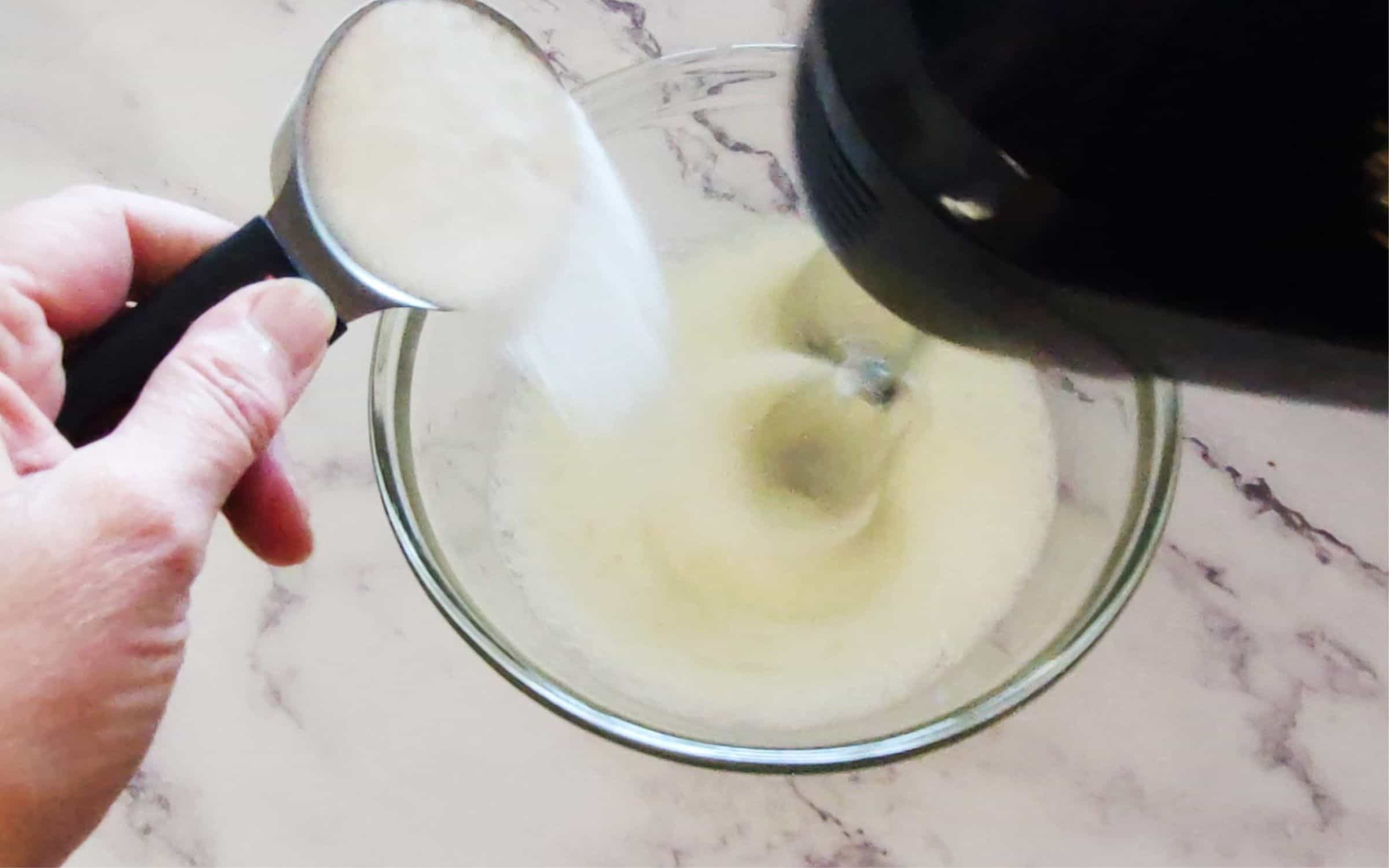 whip eggs to medium peaks while slowly pouring in sugar