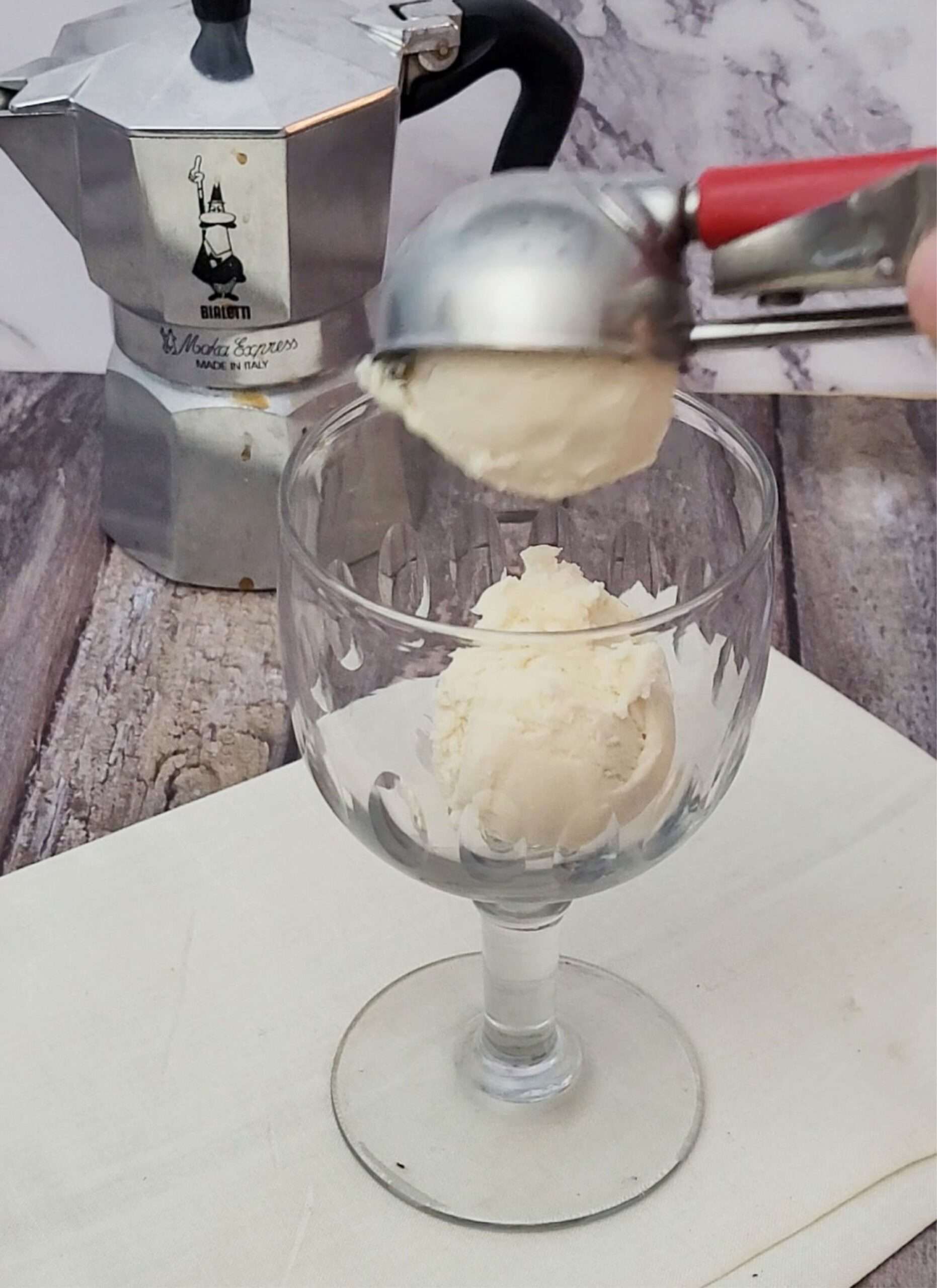 add vanilla ice cream scoops to serving dish to make Affogato