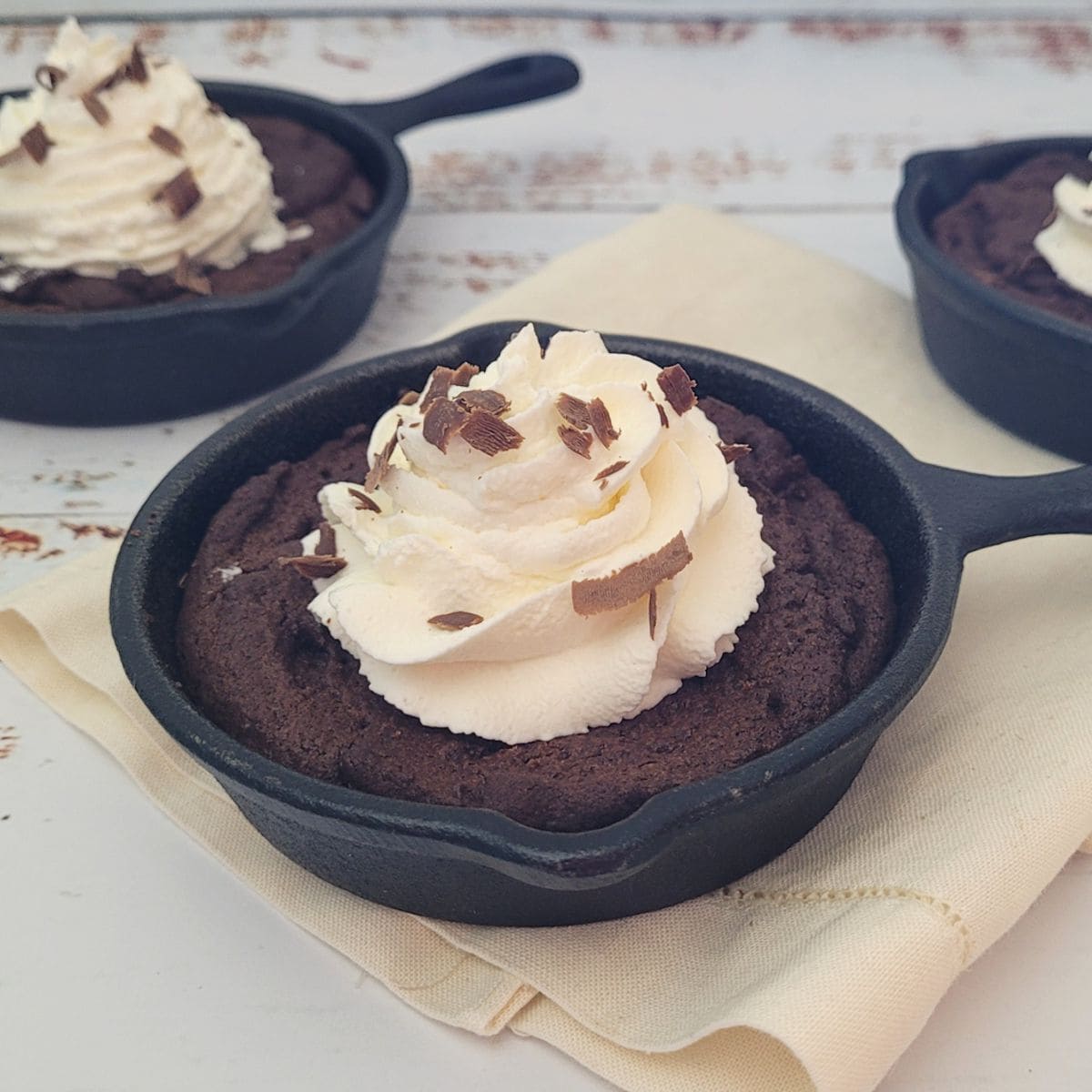 individual cast iron skillet brownies with whipped cream