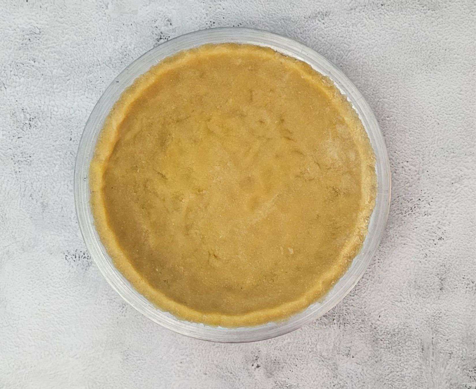 press dough into a pie tin