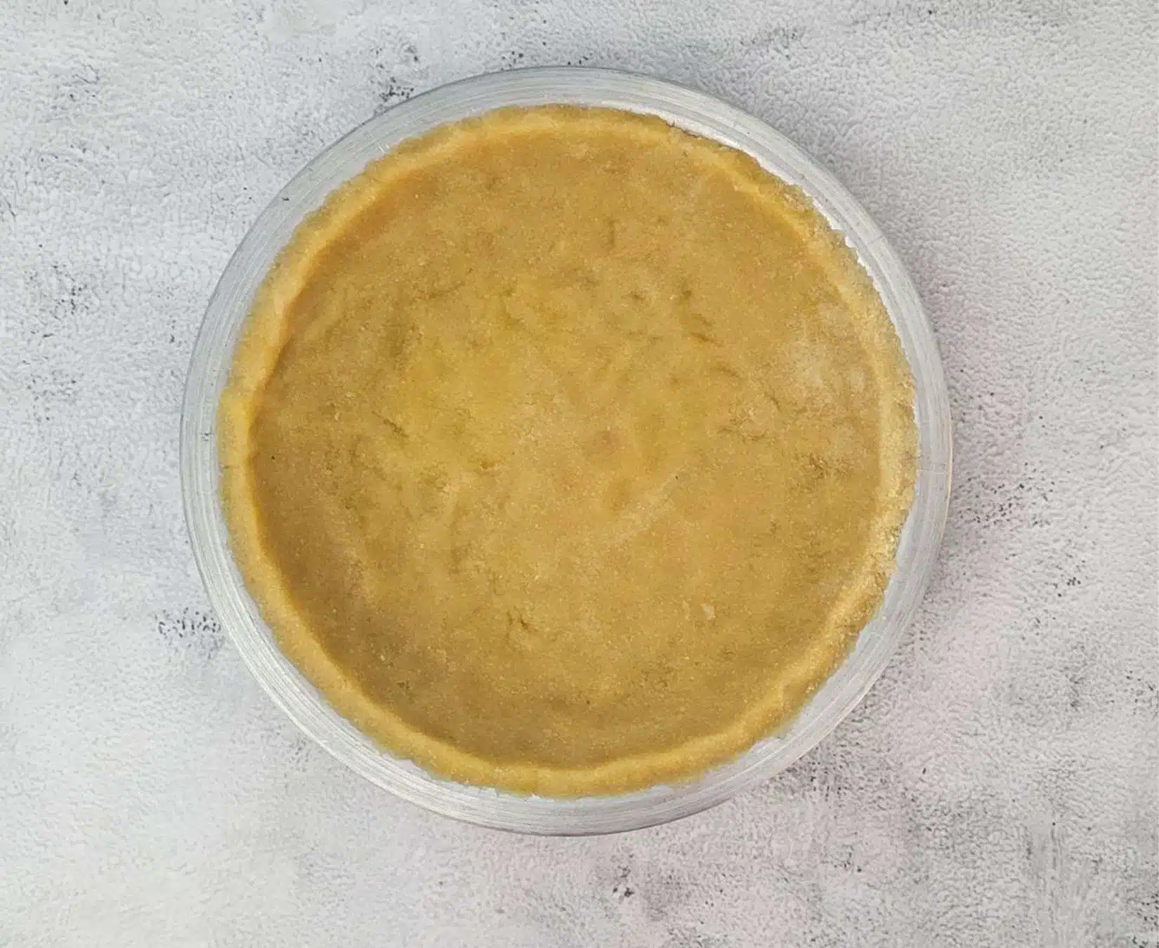 press dough into a pie tin